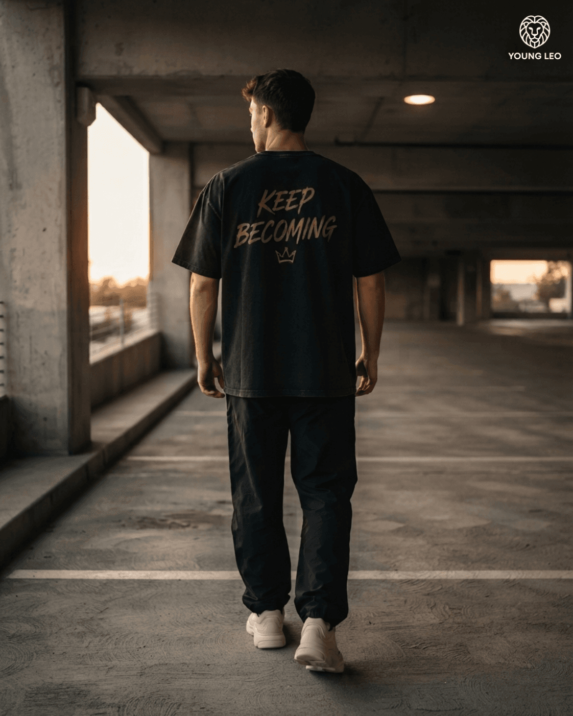 Young Leo campaign — Keep Becoming back print, parking garage at sunset